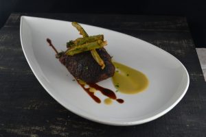 Steak prepared with Mushroom & Onion, Battered Scallion, Wild Mushrooms, Smoked Corn at 1700 Degrees Steakhouse in Harrisburg PA